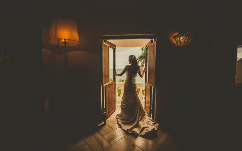 back-view-photo-of-woman-in-wedding-dress-standing-by-3038425